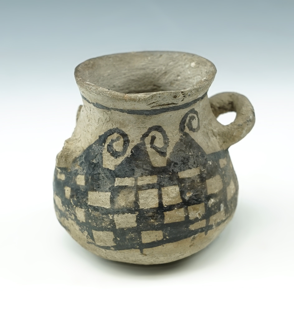 2 1/4" Tall Miniature Anasazi Pottery Vessel with one broken handle. Recoverd in New Mexico.