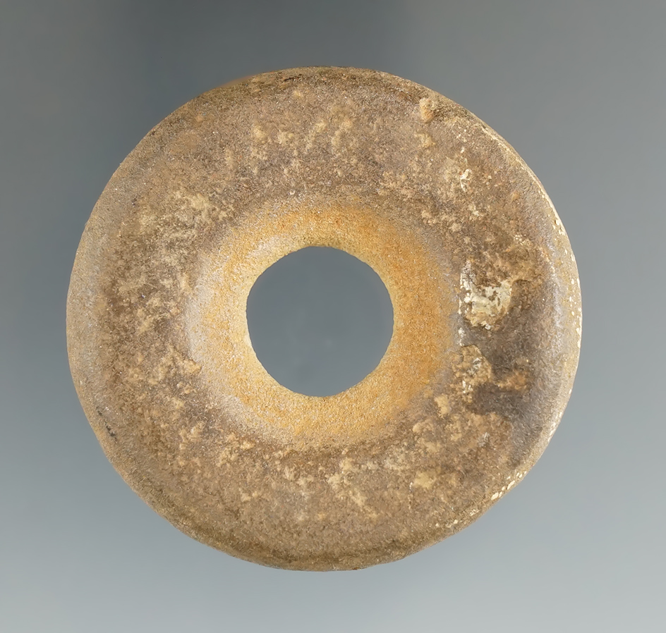 very unique  2" diameter concretion stone which was drilled in center as a miniature Discoidal