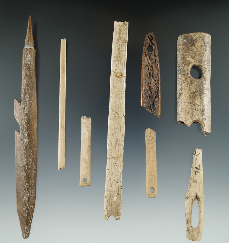 Group of assorted Alaskan bone artifacts recovered near the Bering Sea. Largest is a 6 1/8" harpoon.