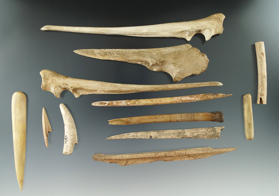 Large assortment of bone awls, one is engraved. Largest is 6 7/8".