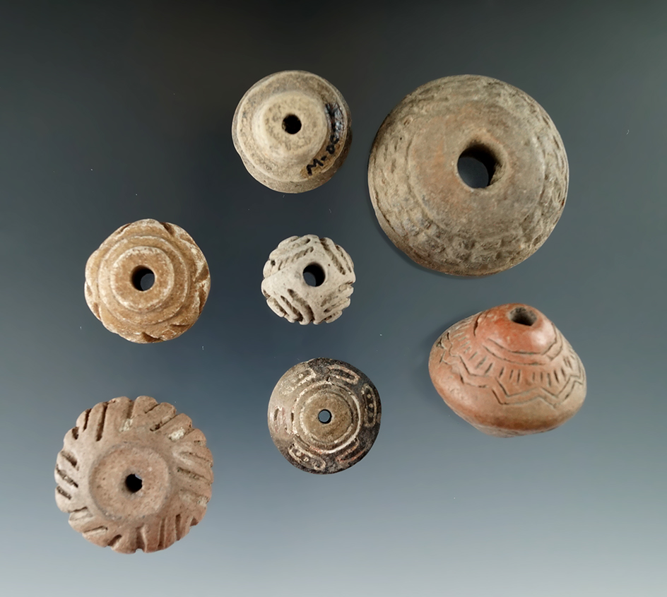 Set of seven assorted Clay Spindle Whorls that are nicely decorated, found in Mexico. Bennett COA.