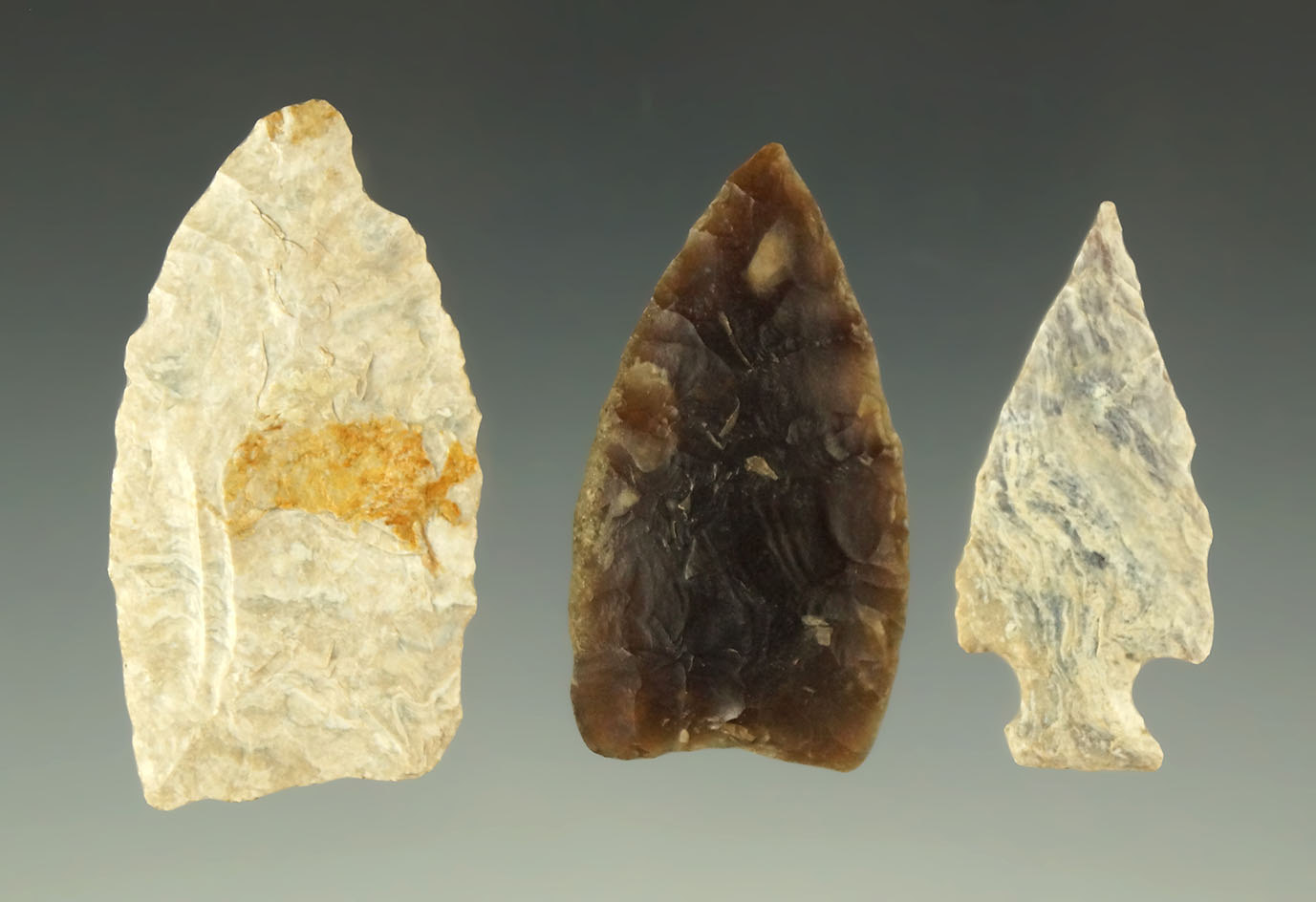 Set of three heavily patinated arrowheads found in the Dakotas area, largest is 1 5/8".