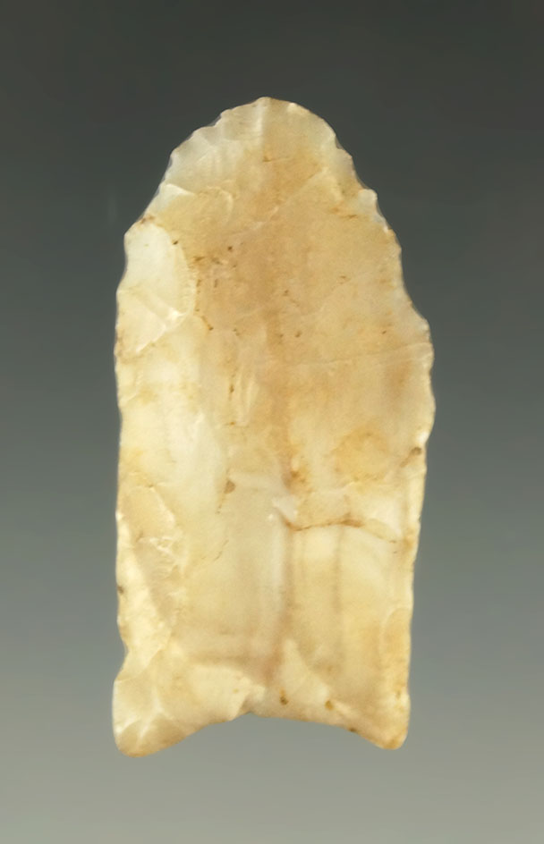 1 5/8" Paleo dart point - heavily ground lower edges made from semi translucent material - KS.