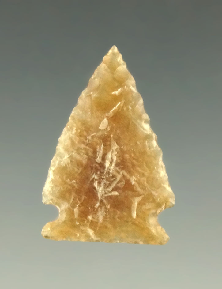 15/16" nicely flaked arrowhead found in the Dakotas made from Highly translucent material.