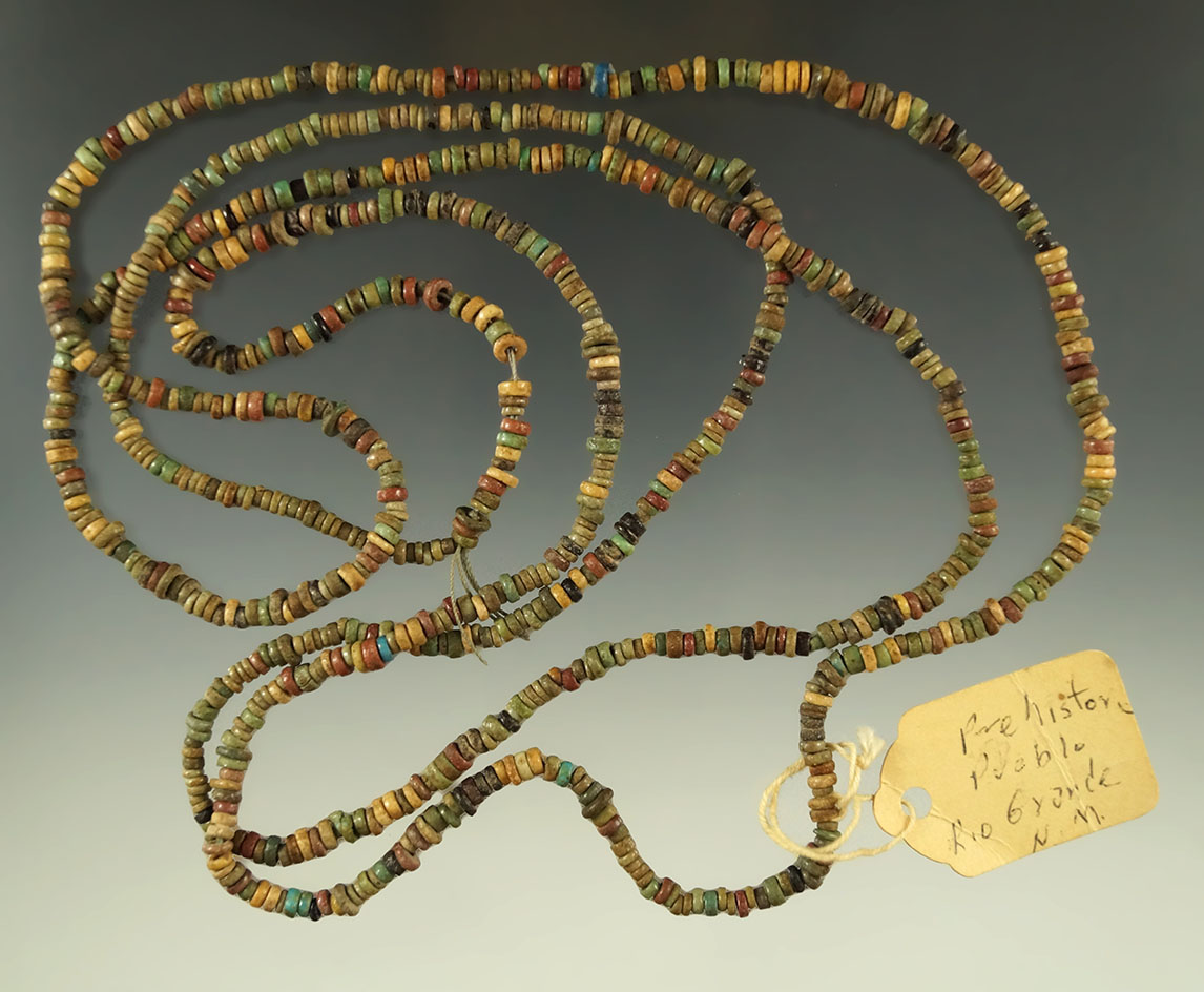 Large 48" long strand of drilled stone beads. Old tag reads "Rio Grande New Mexico."