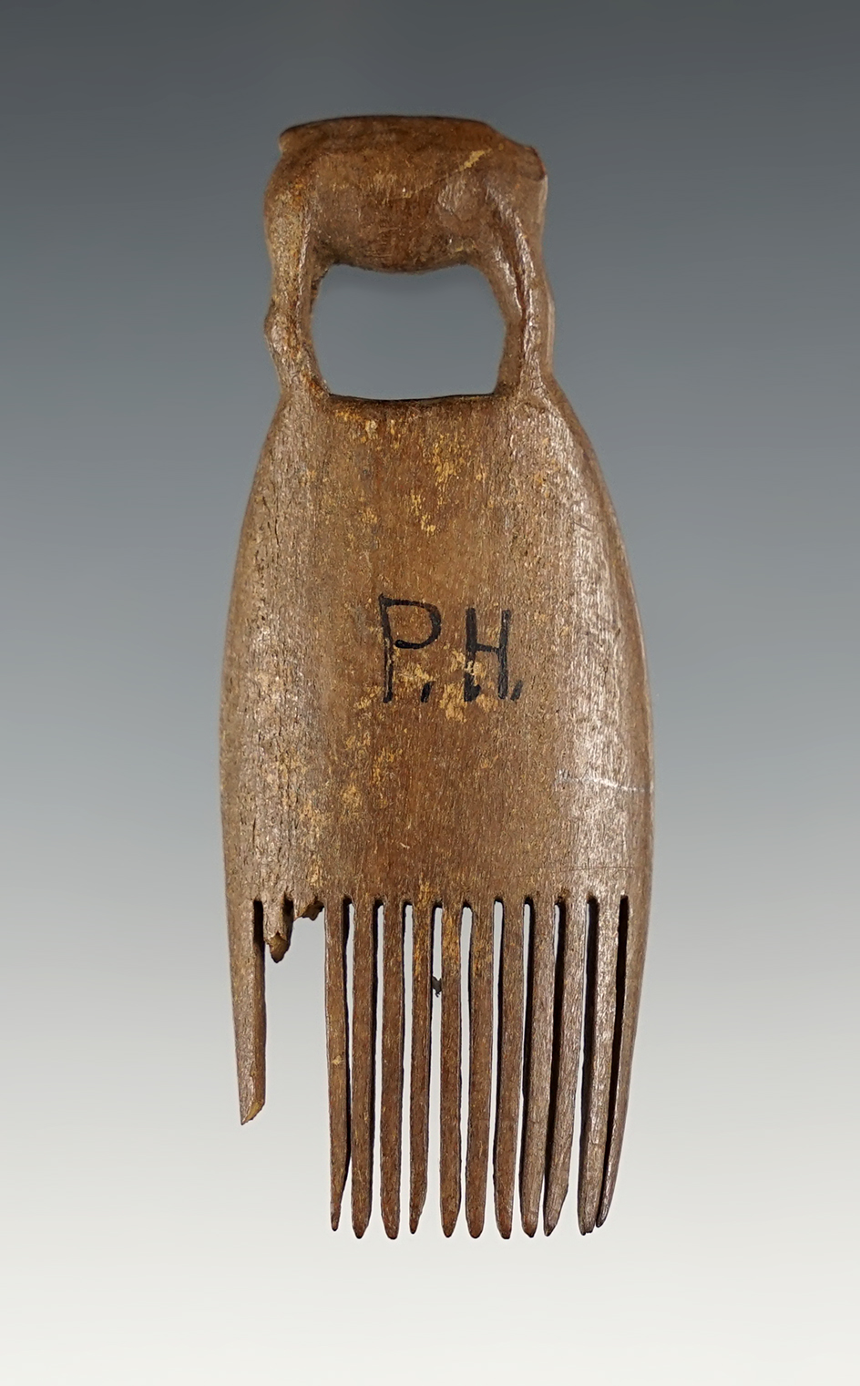 Very well made 2 13/16" Bone Comb with most tines intact. Found in Alaska.