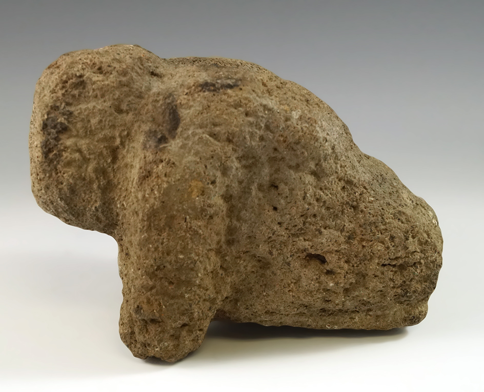 6" Long Aztec carved stone seated Jaguar guardian figure. Circa 1325. Central Mexico Highlands.