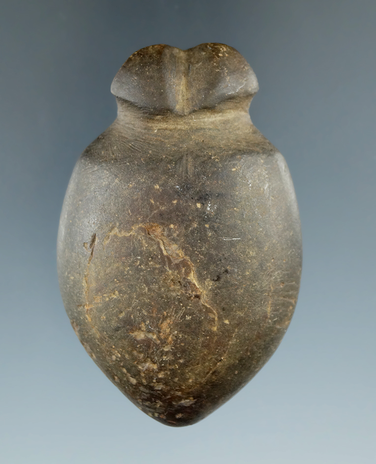 2 15/16" Grooved Plummet with multiple tie-on grooves at top found in Fulton Co., Illinois.