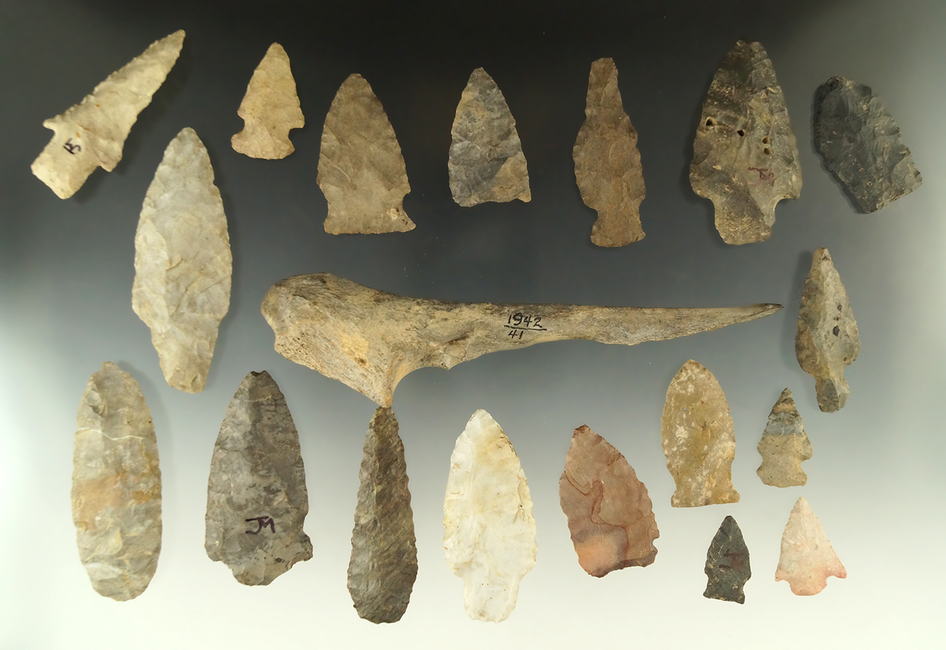 Set of assorted Ohio Flint arrowheads and a 6 1/4" long bone Trigger  Awl found in Ohio.