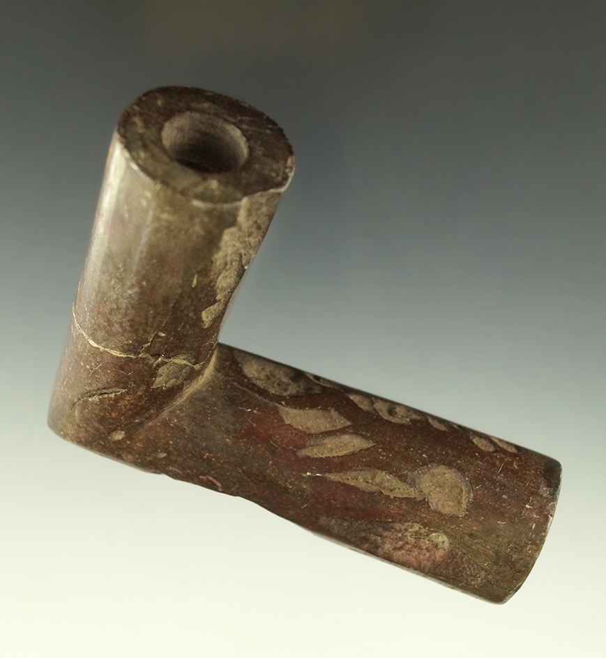 3 1/2" stone pipe which was in a fire which caused pock marks on the surface - Pennsylvania.