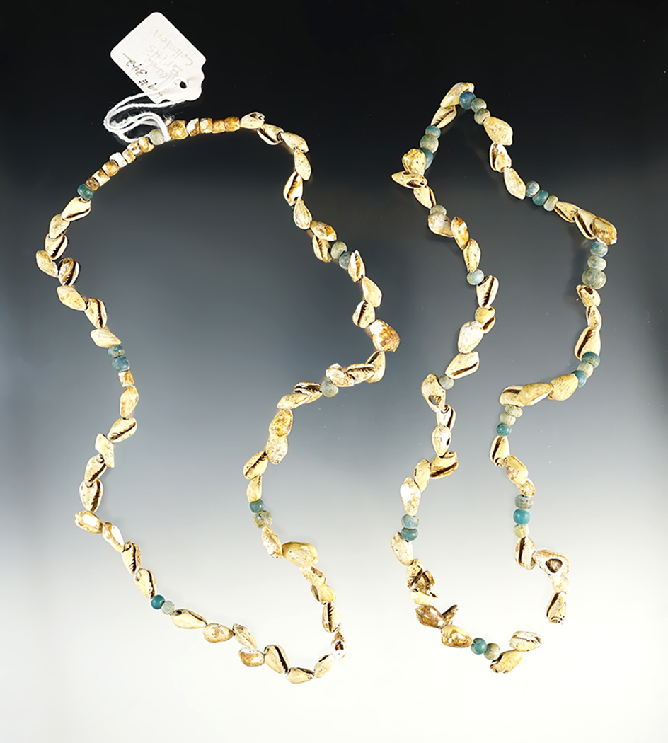 Two strands of drilled shell and glass trade beads found in Logan Co., Ohio. 18" and 16" long.