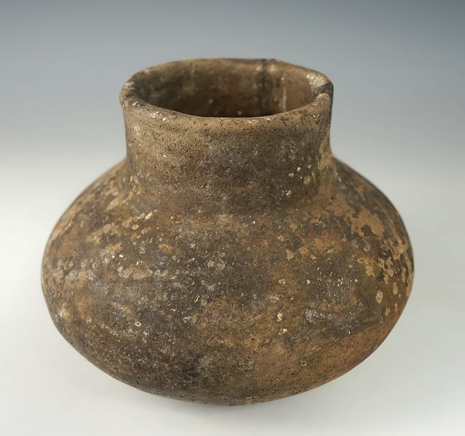 4 3/4" wide by 3 3/8" tall pottery vessel with minor restoration found in Clay Co.,Arkansas.