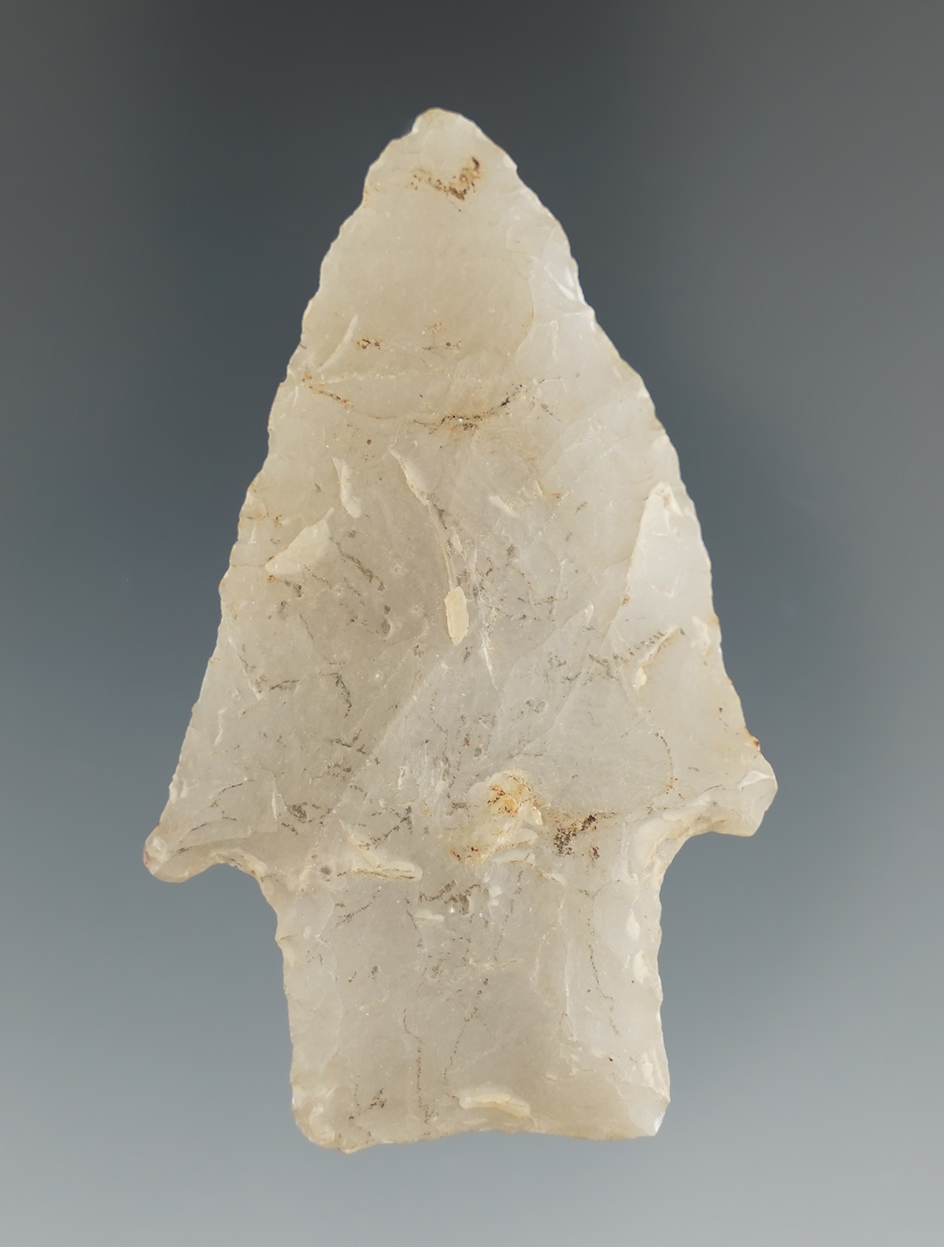 2 7/16" Archaic stem point made from Novaculite found in Arkansas.