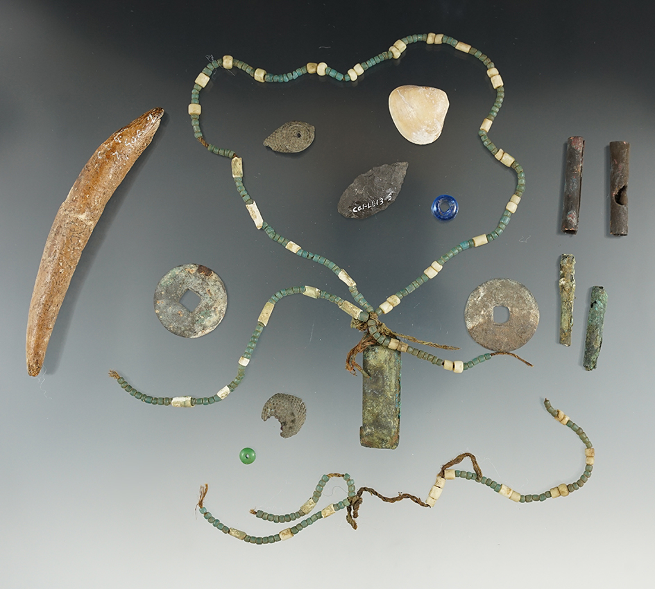 Group of trade beads with original cordage, 2 Chinese coins, 4 copper beads and a copper pendant.