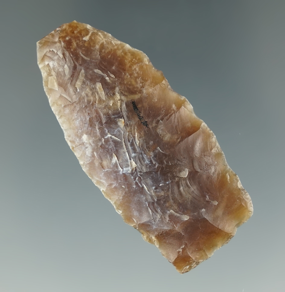 1 15/16" Scottsbluff made from Knife River Flint, found in Iowa. Comes with a Rogers COA.