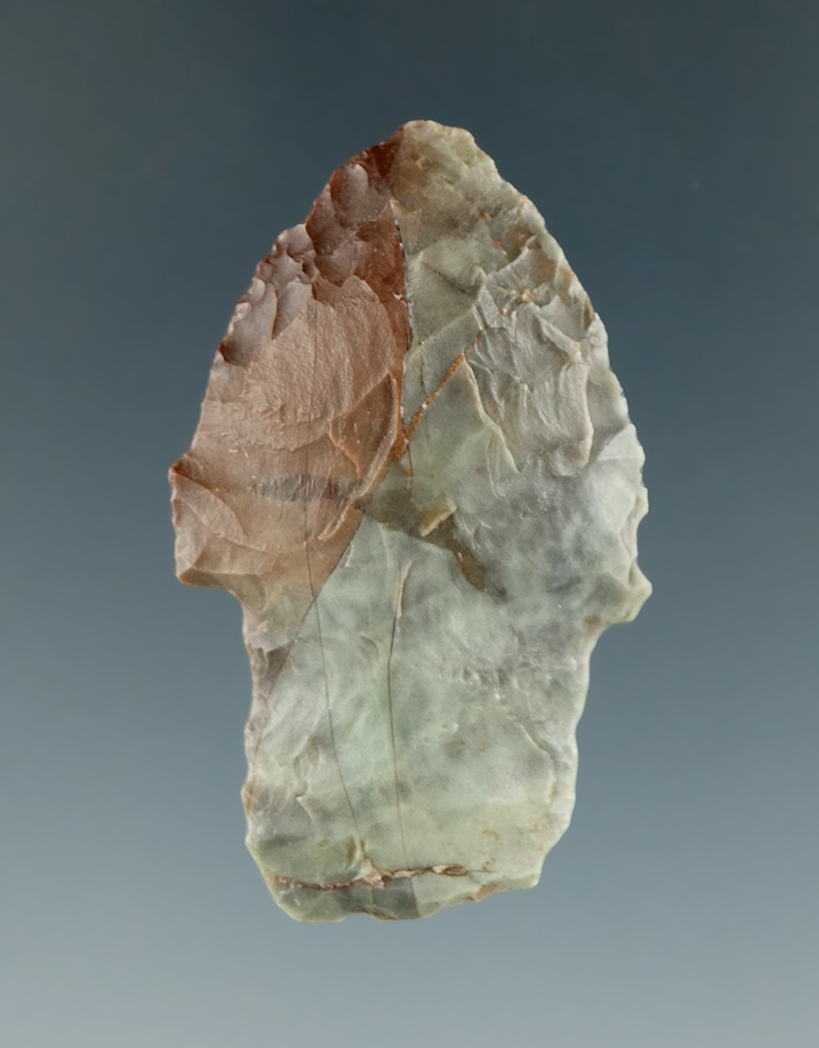 Very nice color pattern on this 1 9/16" stemmed dart point with heavily ground stem area.  Utah.