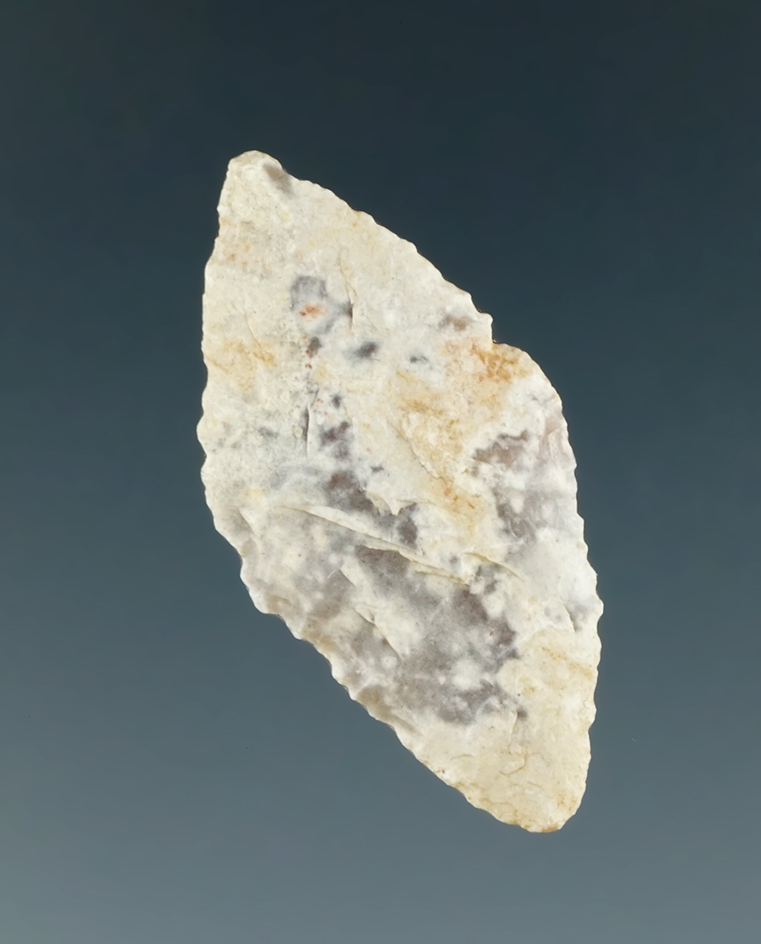 Thin and very unique style on this 1 3/16" heavily patinated agate arrowhead found in Utah.