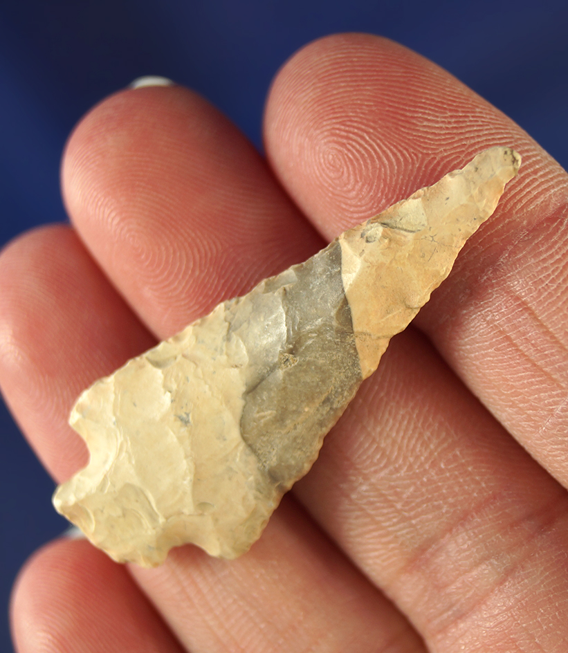 1 5/8" Stemmed dart point that is heavily patinated. Wyoming.