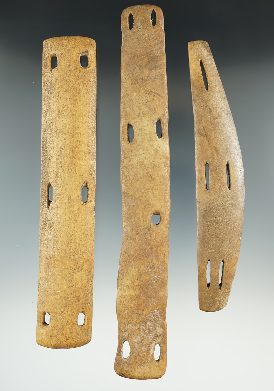 Three sections of Inuit bone armor from Alaska. Largest is 7 5/16".