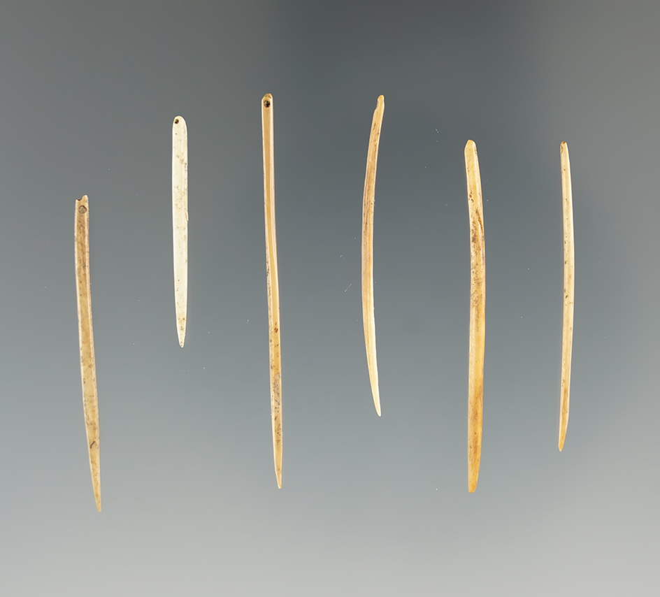Set of six miniature Inuit bone drilled needles, largest is 1 13/16". From Alaska.