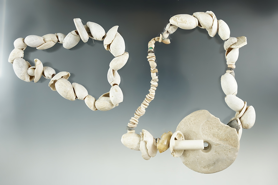 Two strands of shell beads, one with a stone pendant. Both recovered in Arizona.