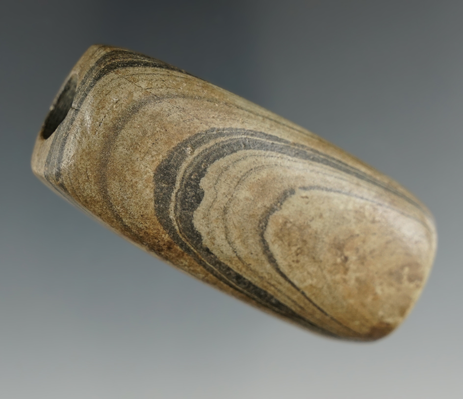 2 9/16" Tube Bannerstone made from Banded Slate. Found in Seneca Co., Ohio. Ex. Jon Dickinson.