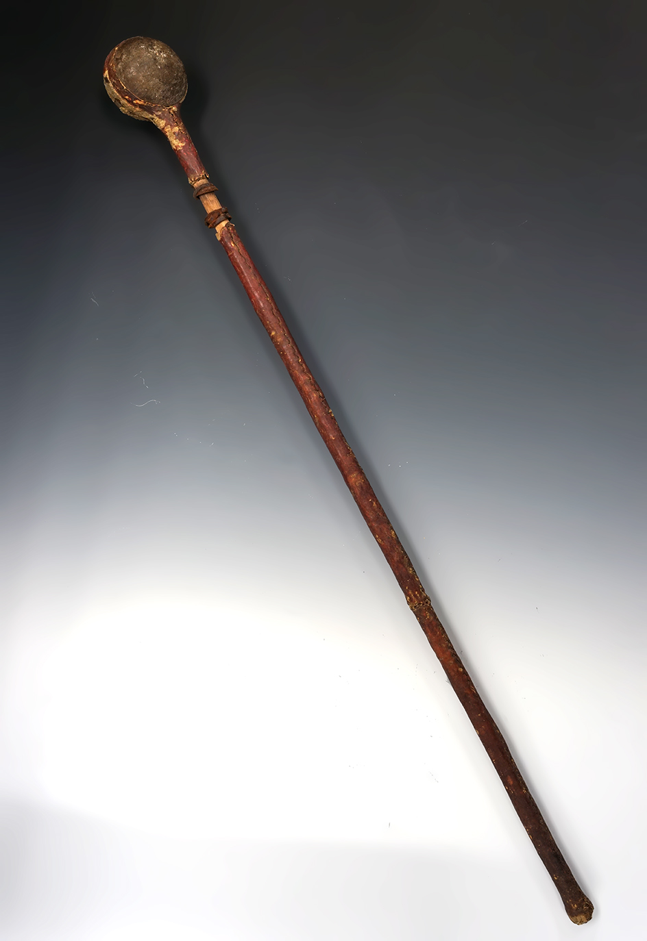 1800's Plains Indian will "Skull Cracker" Club that is 33 1/2" overall length with a stone club head