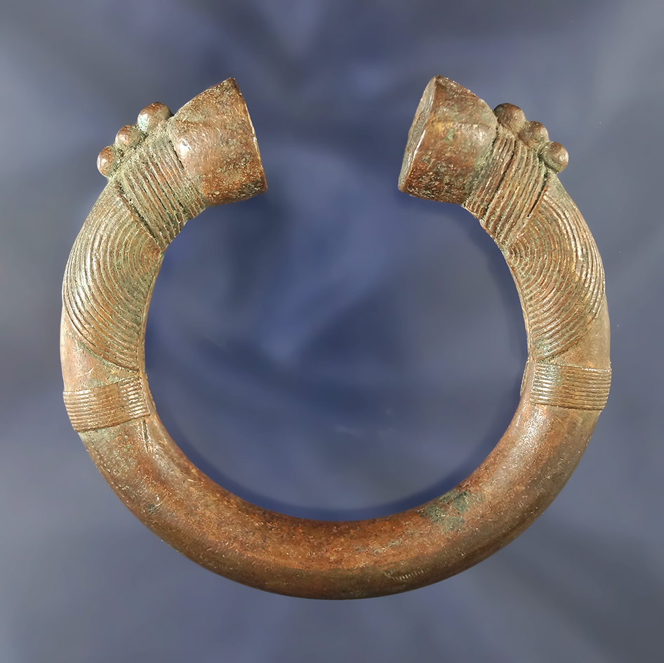 Very unique 3 1/4" beautifully decorated solid copper African "bracelet money" in perfect condition.