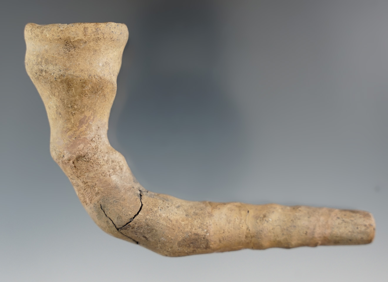 4 1/2"  Iroquois Twist Pipe - broken and reglued at the elbow, broken and mended stem. New York.