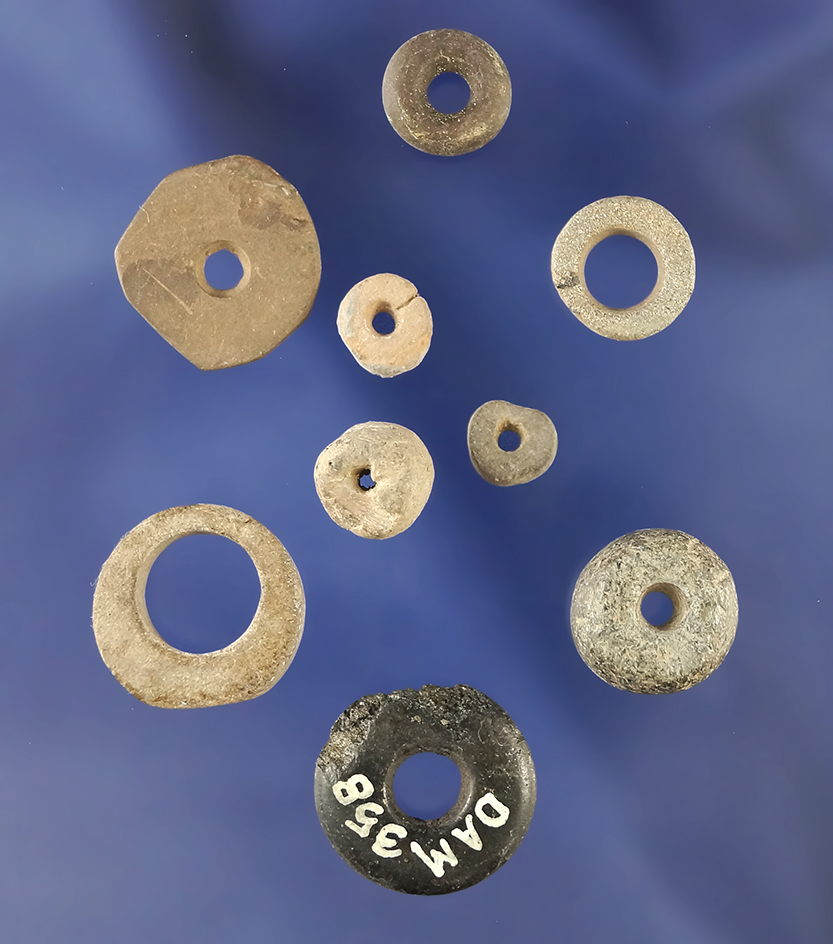 Set of nine stone rings and beads including one found by Charlie Mitchell near the Mabee site.