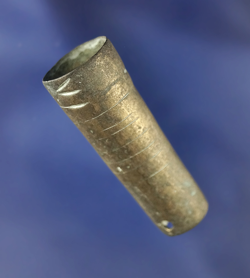 1 11/16" metal tube pipe or bangle. A brass trade piece drilled for suspension.