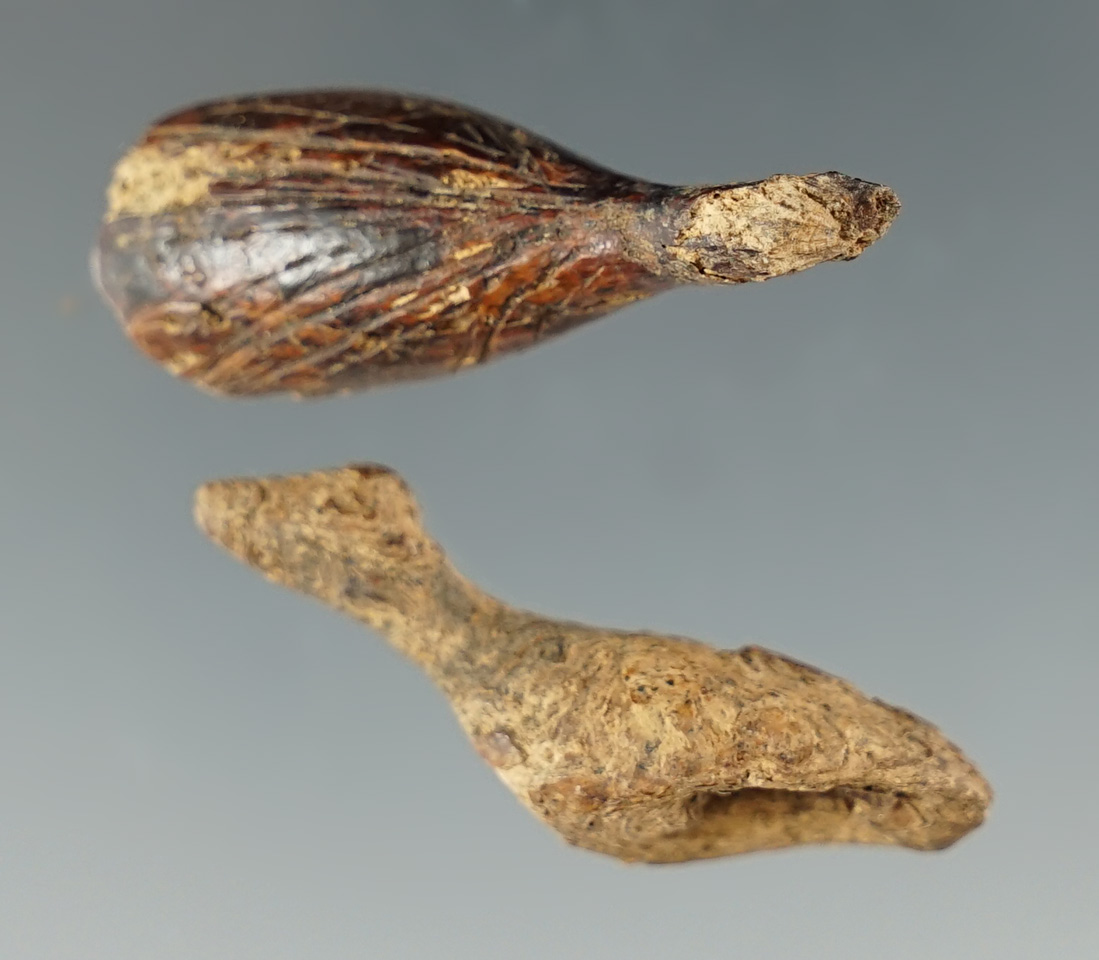 Pair of carved bird effigies found in Alaska, both around 1 3/8" long.