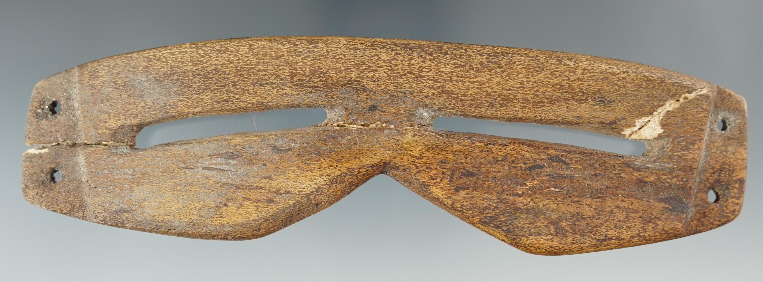 6 1/4" pair of very old Inuit snow goggles recovered in Alaska. (broken and glued)