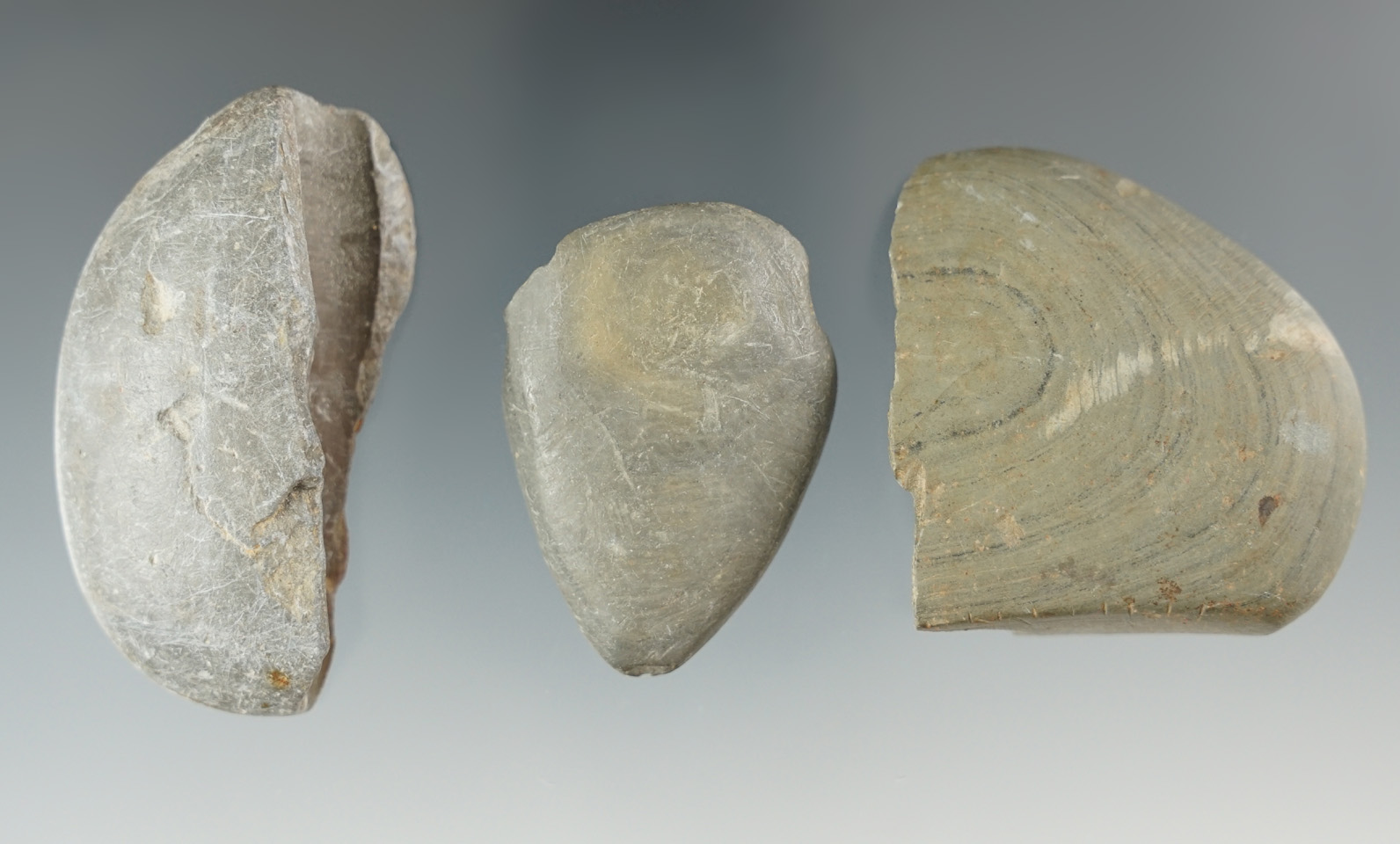 Set of three damage slate artifacts for study including two bannerstone halves.