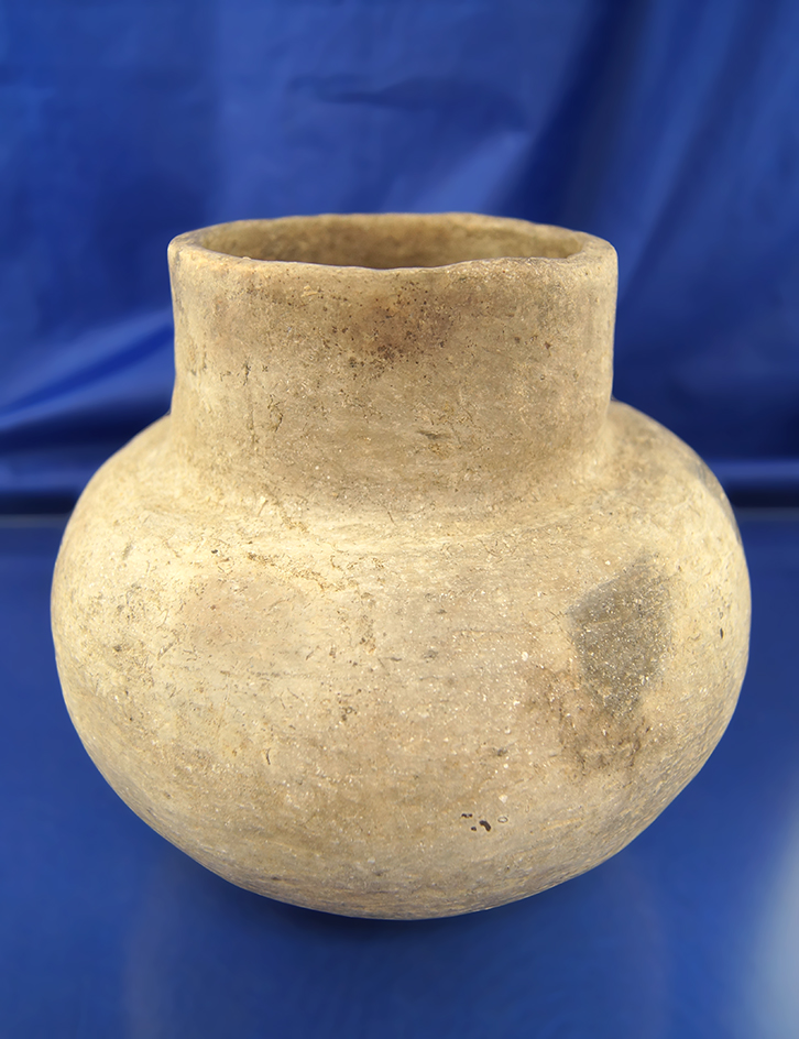 6 1/2" Diameter Water bottle which is solid with fire cloud marks. Found in Arkansas.