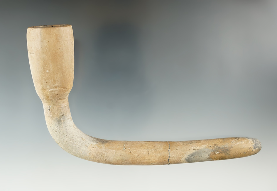 5 5/8" Long Clay Iroquois Pipe with a broken and mended stem - some restoration. New York.