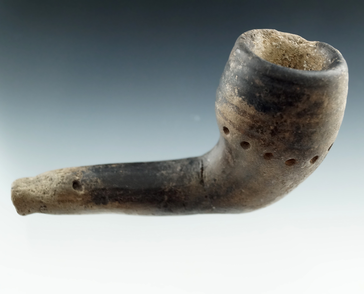 3 1/2" Iroquois Clay Ring Bowl Pipe that is broken and mended at the elbow. Found in New York.