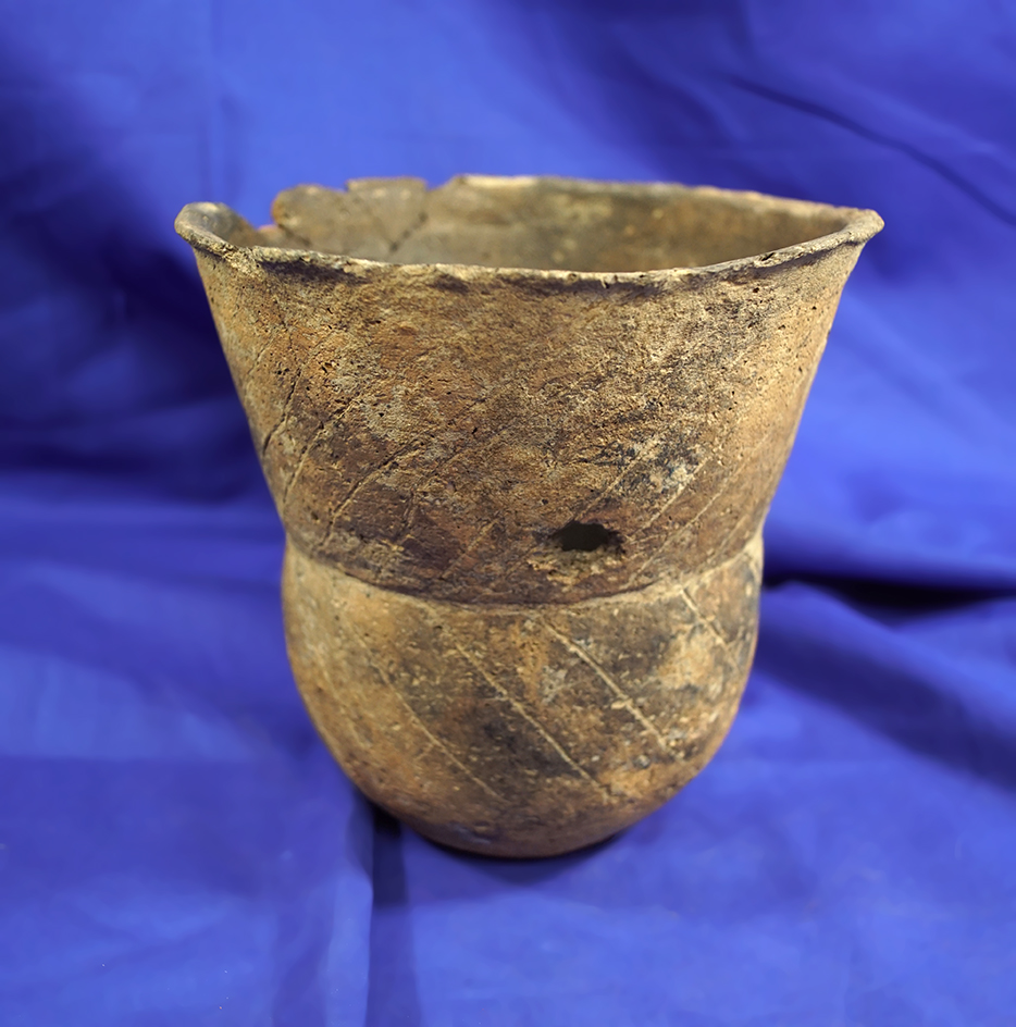 5 3/4" tall thin Caddo engraved jar found in southwest Arkansas with some rim damage.