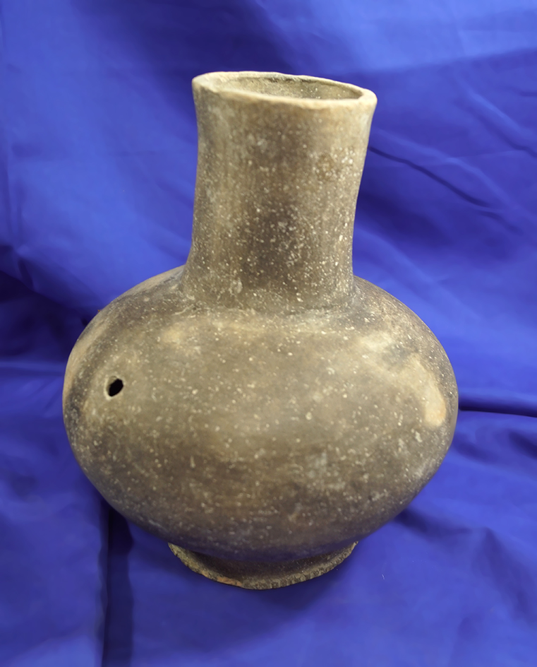 9" tall Perforated Pedestal base water bottle that is solid with one probe hole.  Missouri.