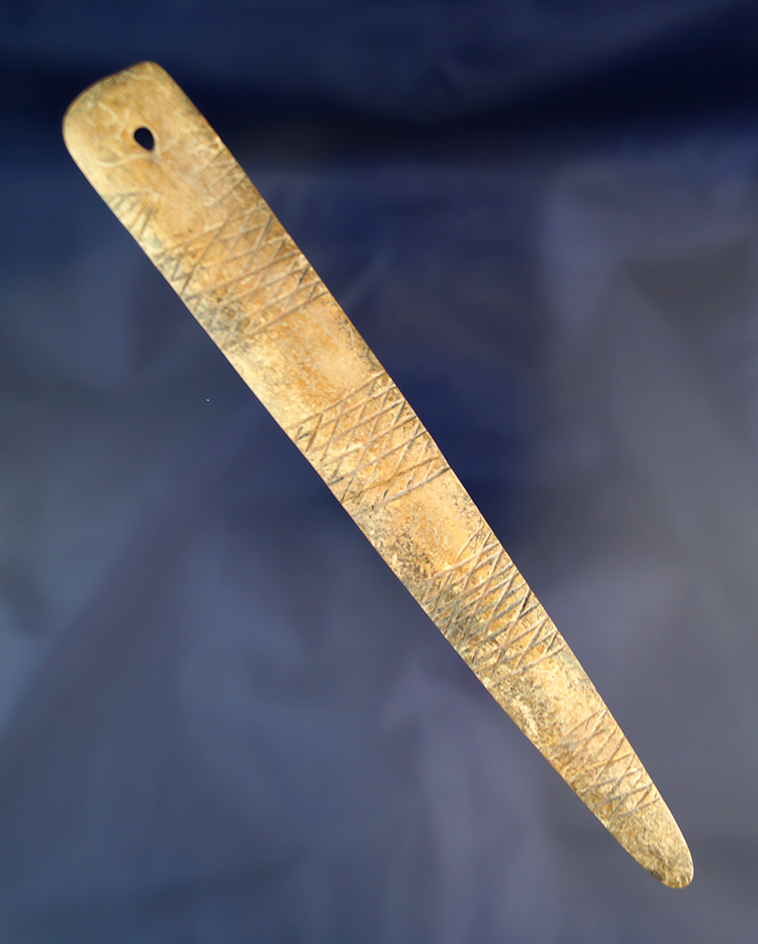 Nice! Highly decorated 7 5/8" Rib Bone Pendant with one restored break that is not visible.