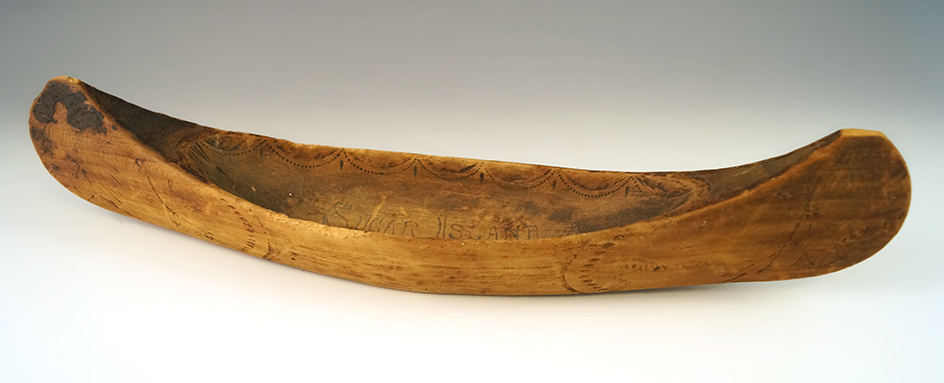 Vintage 13" long handcarved and nicely decorated wooden canoe from Sugar Island, Michigan.