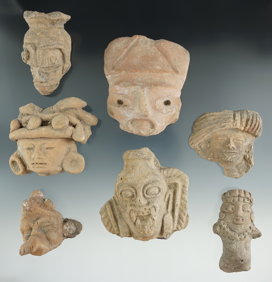 Set of seven pre-Columbian pottery heads found in Mexico. Largest is 2 3/4".