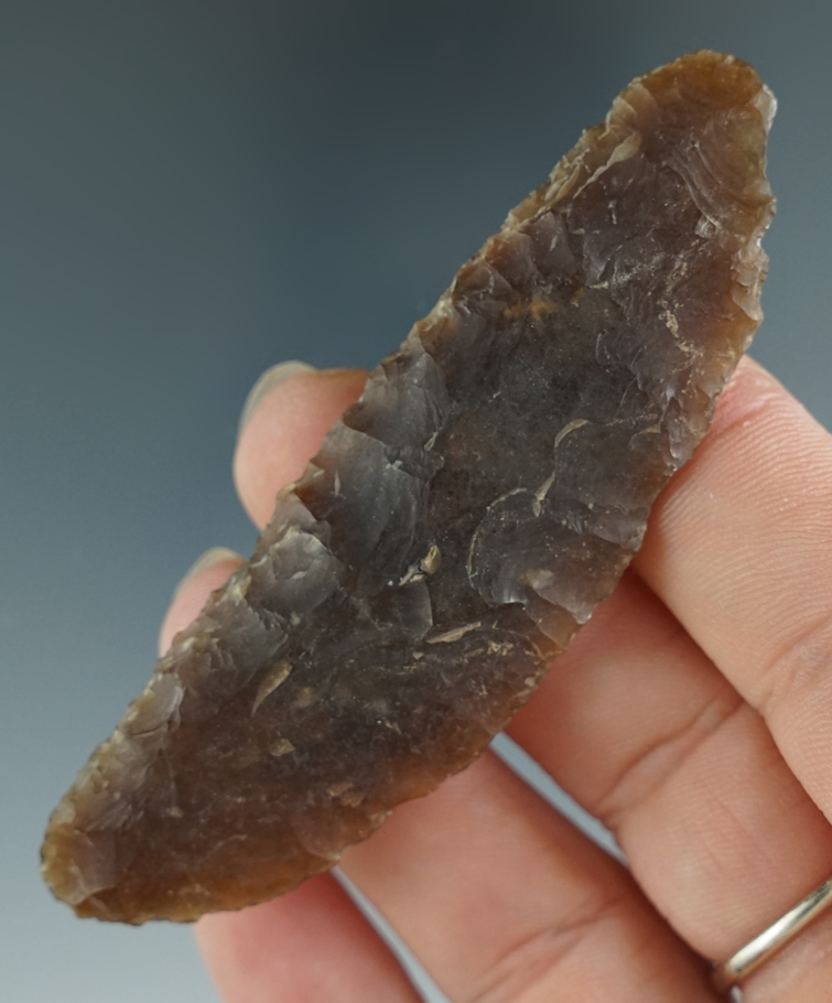 Excellent flaking on this 3 3/16" Knife River Flint blade found in North Dakota. Ex. Karl Parcher.