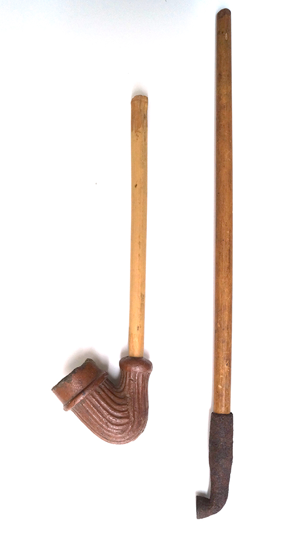 Pair of vintage pipes - one is clay, the other is metal.