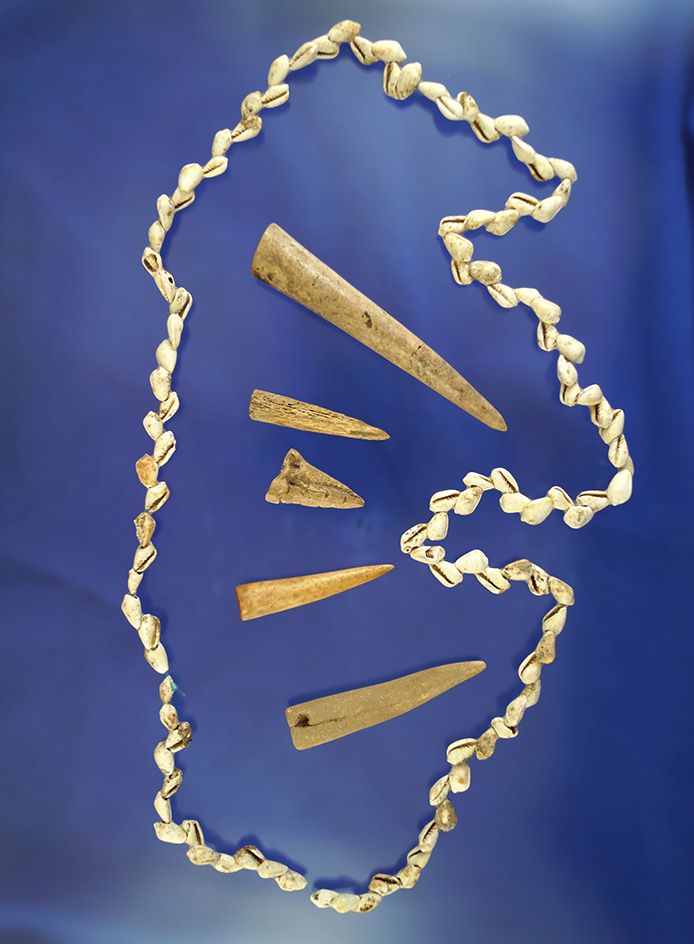 Nice artifact group including five conical antler Tip projectile points and a nice strand ofbeads.
