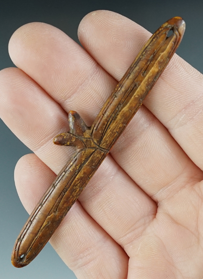 Beautifully decorated incised line Inuit bone ornament that is 3 11/16" long. Recovered in Alaska.
