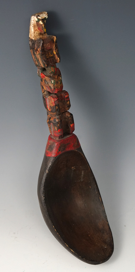 Pacific Northwest carved wooden spoon that is 9 1/2" long.