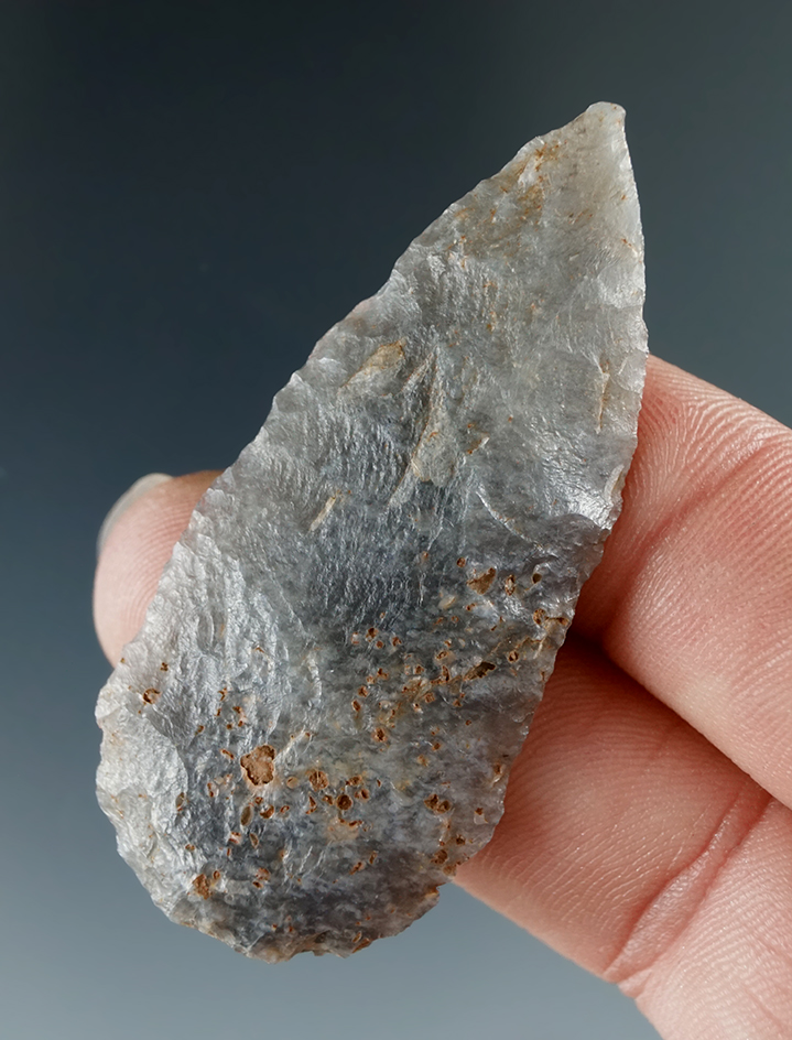 2 1/8" Round Back Knife made from Black and Blue Material found in San Juan Co., New Mexico.