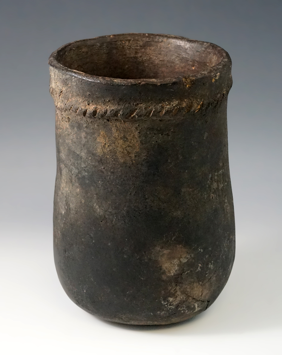 6 7/8" Tall Early Navajo Pot with an appliqué rope around the top. A few surface cracks at base.