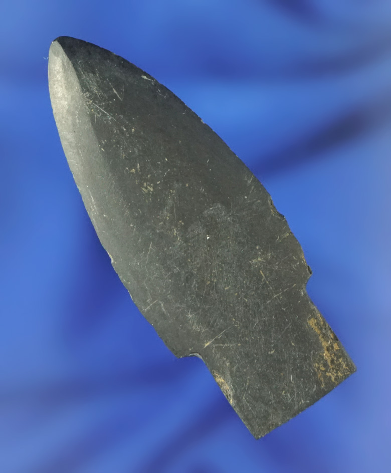 2" arrowhead that is perfectly shaped from ground slate found in Alaska.